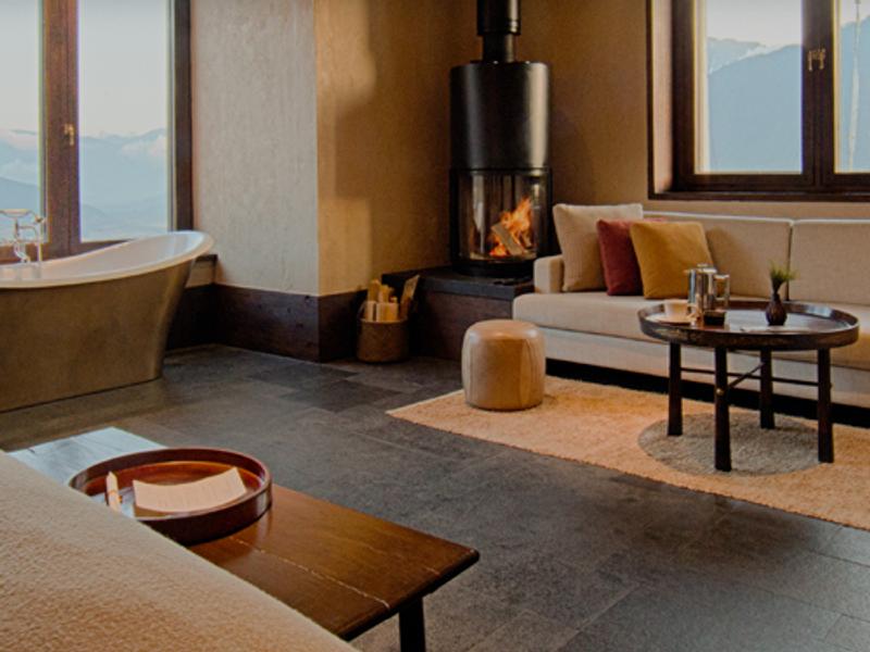 Bedroom with bath tub at Gangtey Lodge