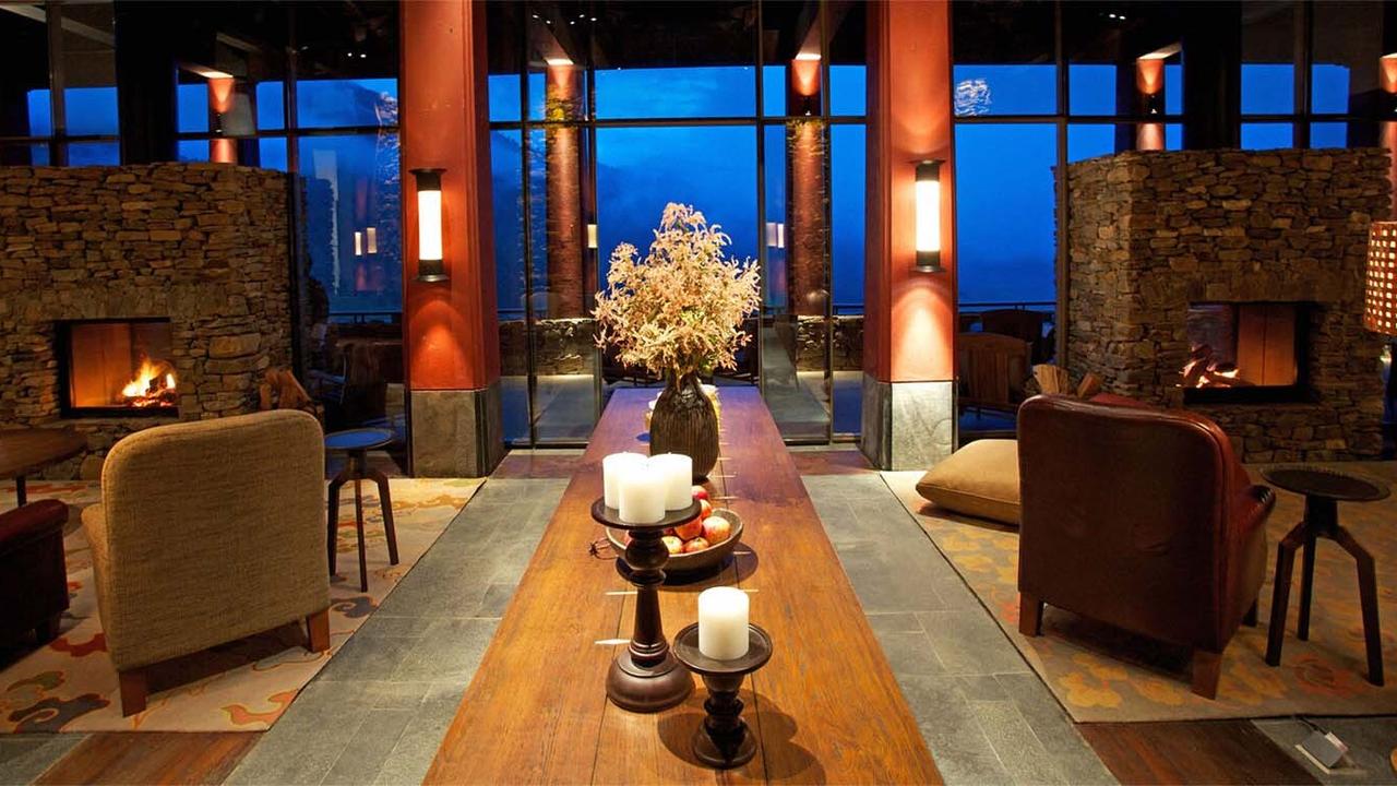 Armchairs by the fire at Gangtey Lodge