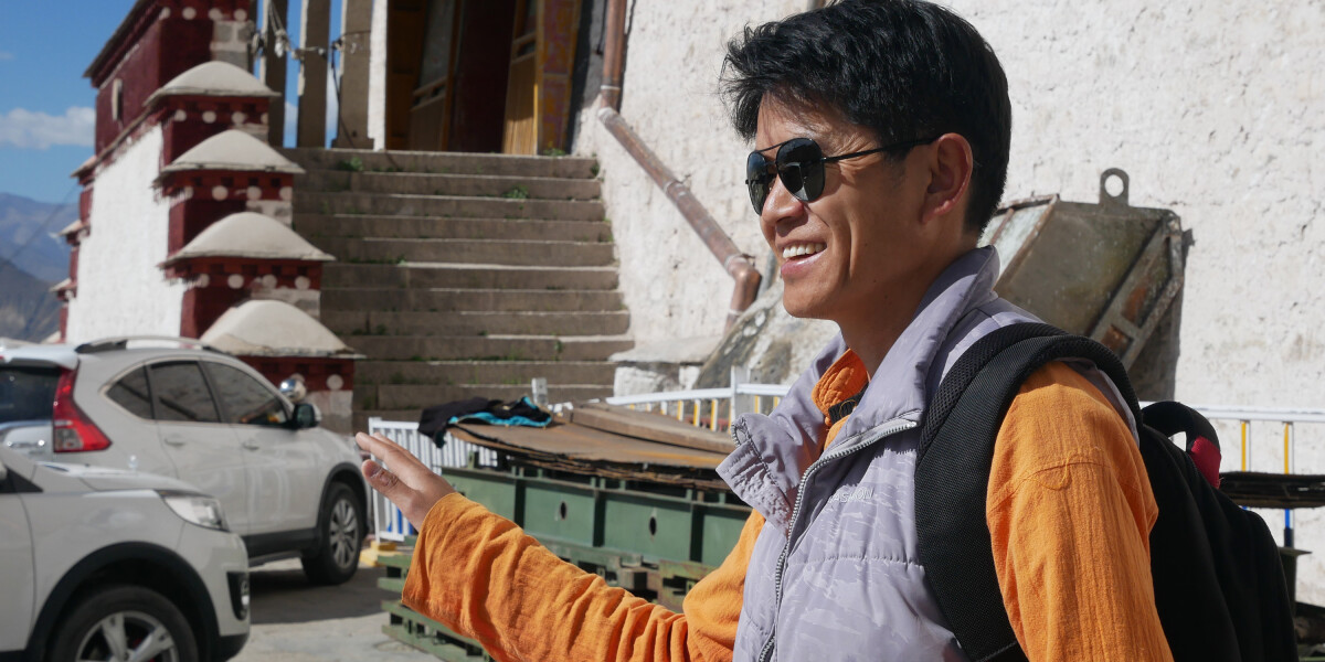 Sonam, smiling in his Raybans