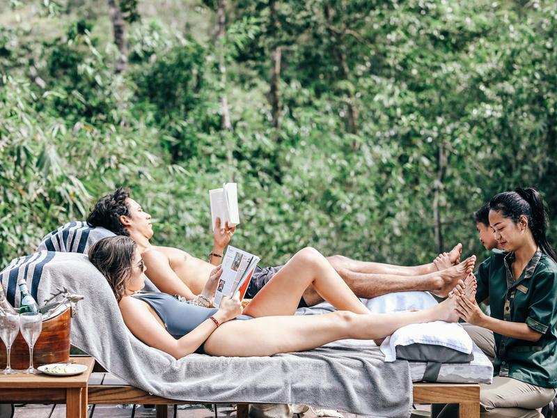 Couple having foot massages at Shinta Mani Wild