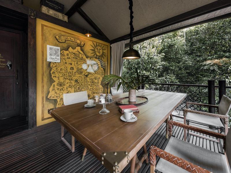 Seating area with map at Shinta Mani Wild