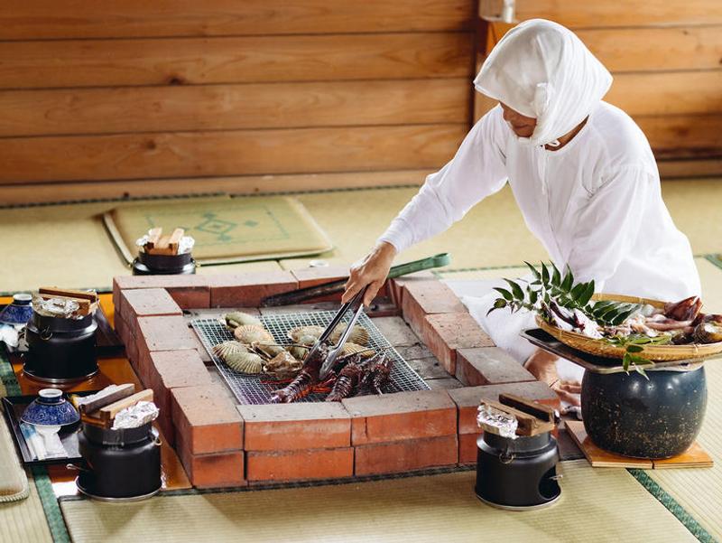 Woman cooking on bbq