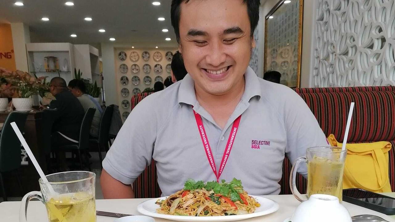 Selective Asia guide at restaurant in Vietnam