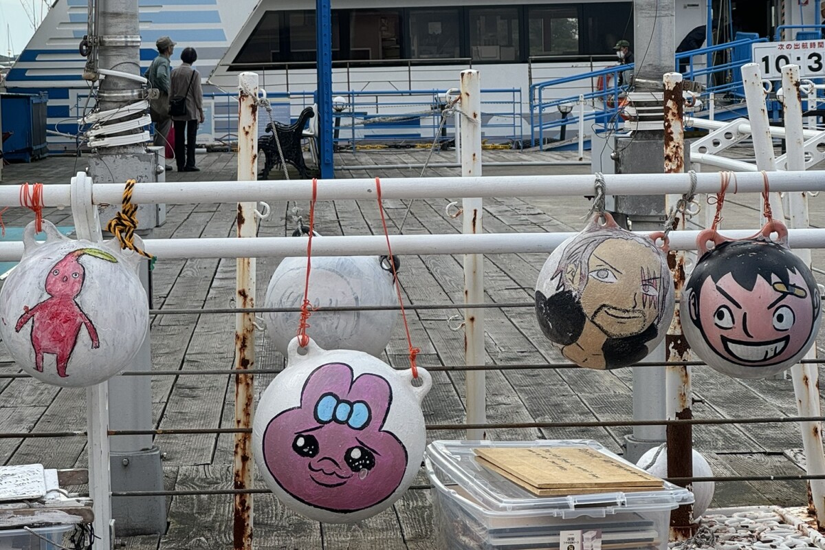 Painted buoys on railings Japan