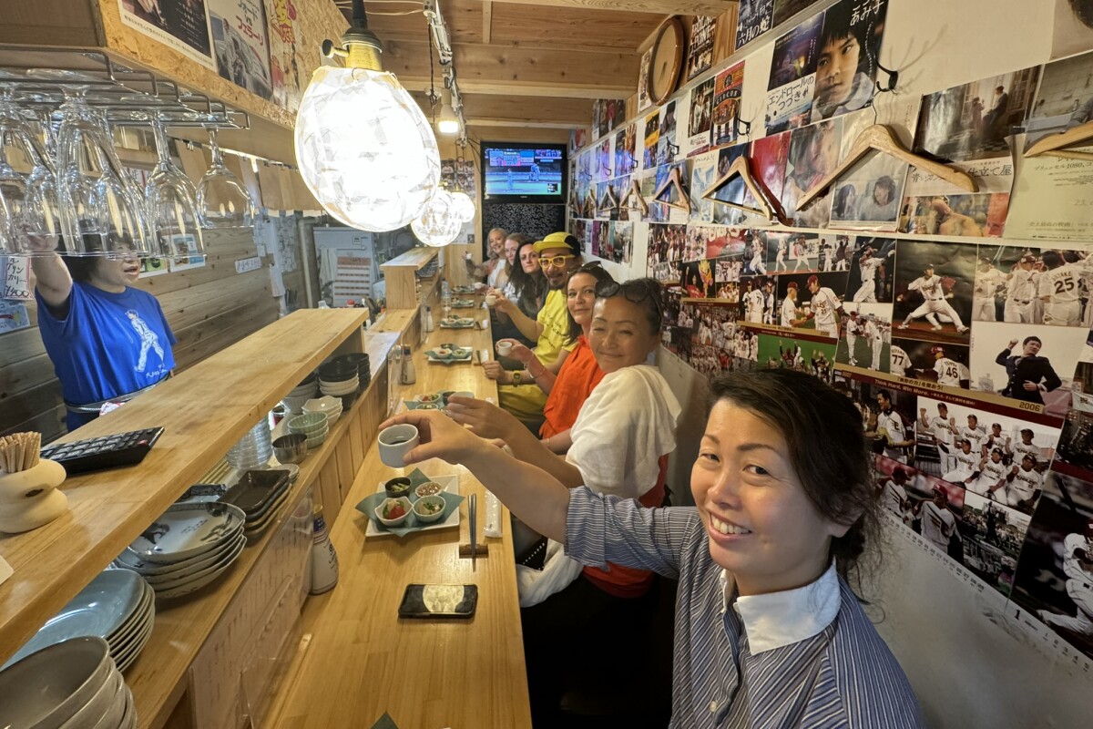 Group enjoying a meal together, Japan